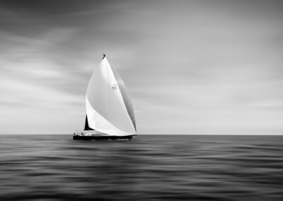 Italian for "guiding light" — a fitting name for a yacht racing beneath a dramatic sky.